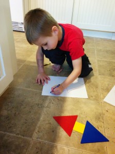 My son drawing the shapes.